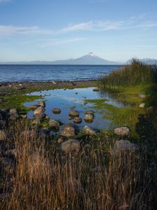 Preview wallpaper pond, stones, sea, volcano, nature