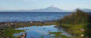 Preview wallpaper pond, stones, sea, volcano, nature