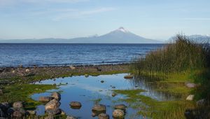 Preview wallpaper pond, stones, sea, volcano, nature