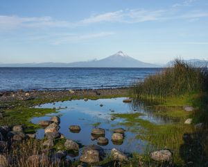 Preview wallpaper pond, stones, sea, volcano, nature