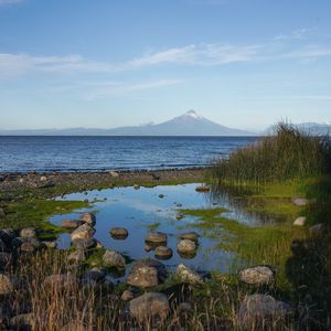 Preview wallpaper pond, stones, sea, volcano, nature