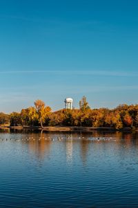 Preview wallpaper pond, trees, tower, sky