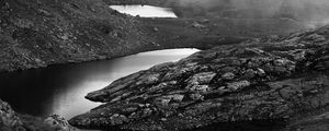 Preview wallpaper ponds, fog, mountains, stones, black and white