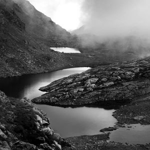 Preview wallpaper ponds, fog, mountains, stones, black and white