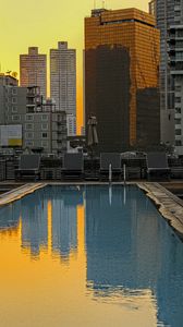 Preview wallpaper pool, buildings, city, sunrise