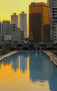 Preview wallpaper pool, buildings, city, sunrise