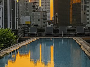 Preview wallpaper pool, buildings, city, sunrise