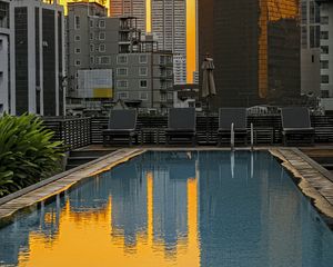 Preview wallpaper pool, buildings, city, sunrise