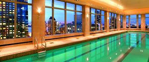 Preview wallpaper pool, water, city, interior, windows, hotel, light