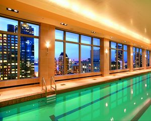 Preview wallpaper pool, water, city, interior, windows, hotel, light