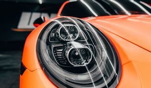 Preview wallpaper porsche, car, orange, headlight, front view