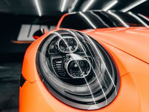 Preview wallpaper porsche, car, orange, headlight, front view