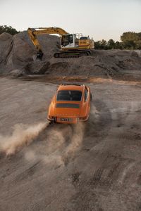 Preview wallpaper porsche, car, rear view, sand, road