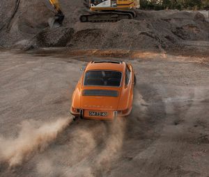 Preview wallpaper porsche, car, rear view, sand, road