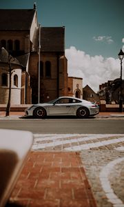 Preview wallpaper porsche, car, silver, road, buildings, architecture