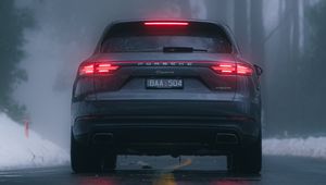 Preview wallpaper porsche cayenne, porsche, car, suv, gray, rear view, road, fog