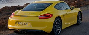 Preview wallpaper porsche, cayman s, yellow, rear view