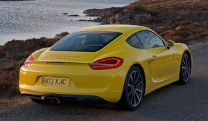 Preview wallpaper porsche, cayman s, yellow, rear view