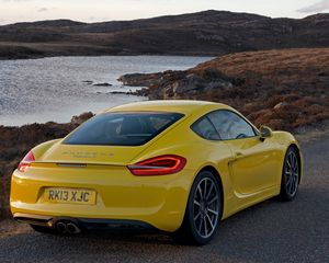 Preview wallpaper porsche, cayman s, yellow, rear view