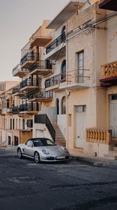 Preview wallpaper porsche, sports car, building, facade, street, marsalforn, malta