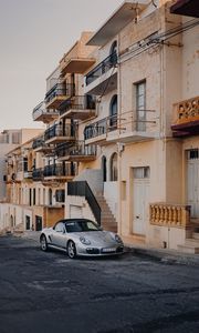 Preview wallpaper porsche, sports car, building, facade, street, marsalforn, malta