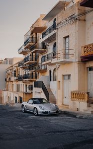 Preview wallpaper porsche, sports car, building, facade, street, marsalforn, malta