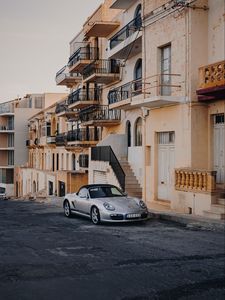 Preview wallpaper porsche, sports car, building, facade, street, marsalforn, malta