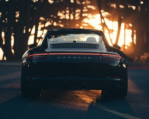 Preview wallpaper porsche, sports car, rear view, black, sunlight