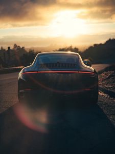 Preview wallpaper porsche, sports car, rear view, black, sunlight, movement