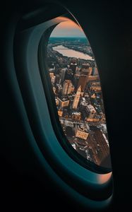 Preview wallpaper porthole, airplane, city, window