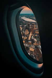 Preview wallpaper porthole, airplane, city, window