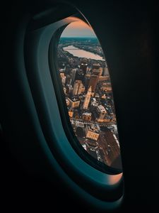 Preview wallpaper porthole, airplane, city, window