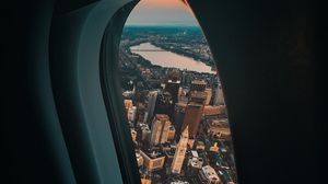 Preview wallpaper porthole, airplane, city, window