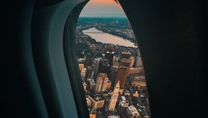 Preview wallpaper porthole, airplane, city, window