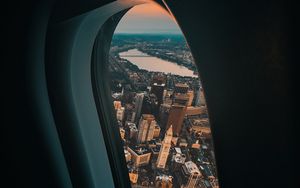 Preview wallpaper porthole, airplane, city, window