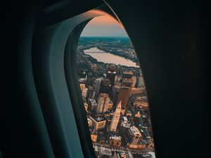 Preview wallpaper porthole, airplane, city, window