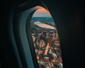 Preview wallpaper porthole, airplane, city, window