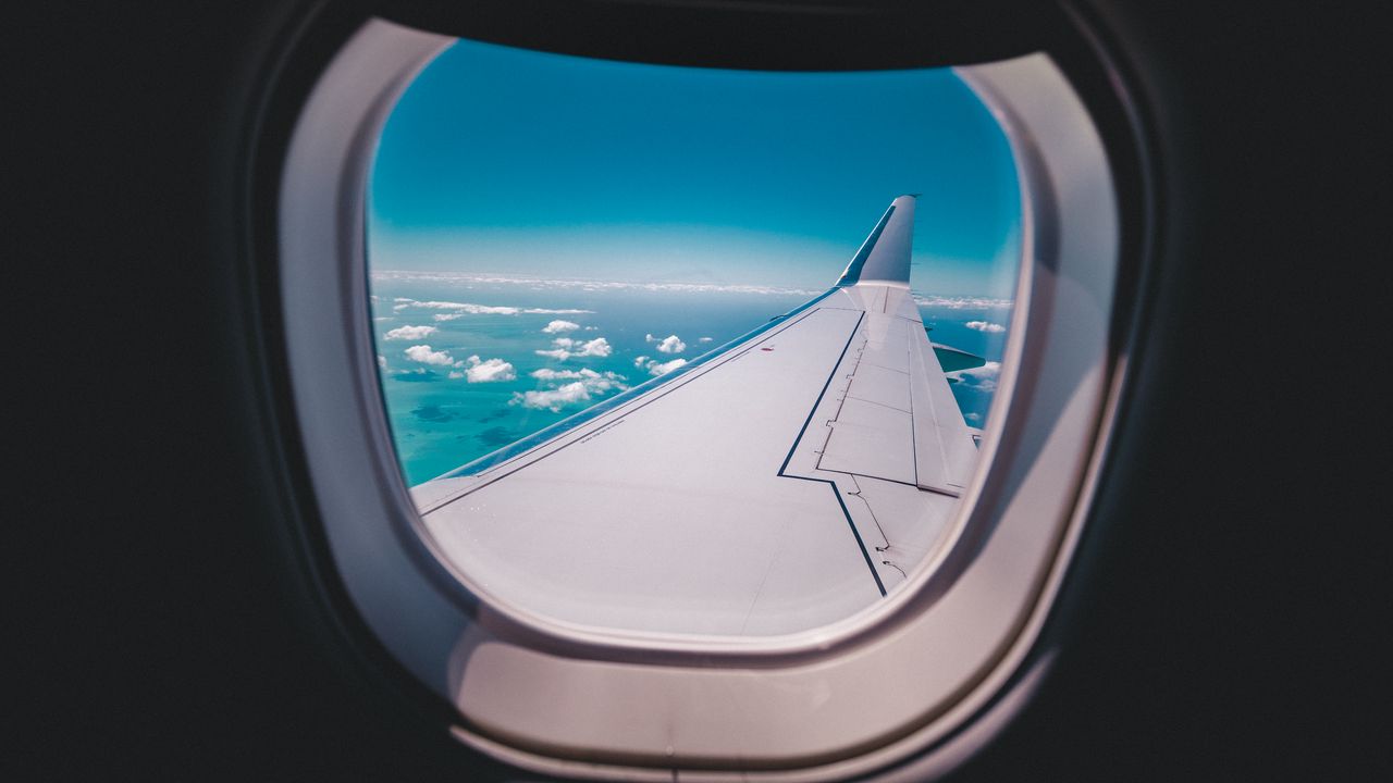 Wallpaper porthole, airplane, wing, sky hd, picture, image