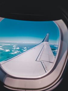 Preview wallpaper porthole, airplane, wing, sky