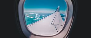 Preview wallpaper porthole, airplane, wing, sky