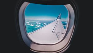 Preview wallpaper porthole, airplane, wing, sky
