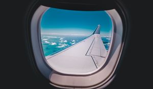 Preview wallpaper porthole, airplane, wing, sky