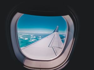 Preview wallpaper porthole, airplane, wing, sky