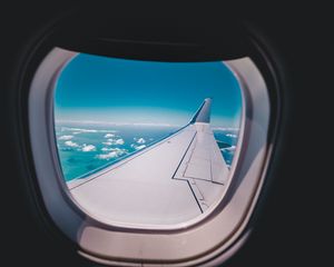 Preview wallpaper porthole, airplane, wing, sky