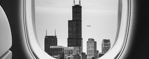 Preview wallpaper porthole, bw, airplane window, buildings, flight