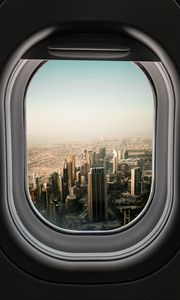 Preview wallpaper porthole, city, skyscrapers, aerial view, window