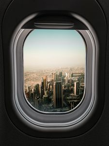 Preview wallpaper porthole, city, skyscrapers, aerial view, window