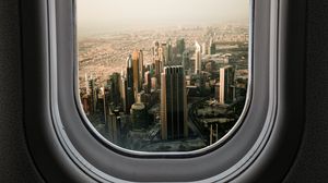 Preview wallpaper porthole, city, skyscrapers, aerial view, window