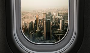 Preview wallpaper porthole, city, skyscrapers, aerial view, window