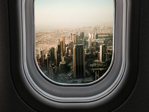 Preview wallpaper porthole, city, skyscrapers, aerial view, window